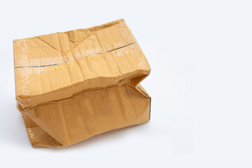 Damaged cardboard box on white background.