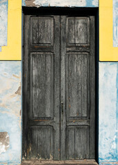 Beautiful view to weathered wooden door of canarian colonial style house in the old town of Santa Cruz de La Palma. Copy space.