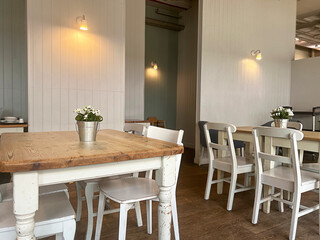 Empty coffee tables in a coffee shop background