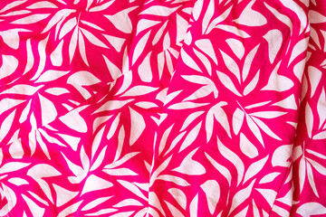 Magenta floral cloth pattern for background and with copy space. Beautiful floral design on magenta blouse textured. Vintage design. Close up photo. Summer vibes.
