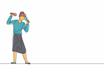 Continuous one line drawing woman street band player mariachi plays maracas. Female performer with maracas musical instruments, mariachi player at national festival. Single line design vector graphic