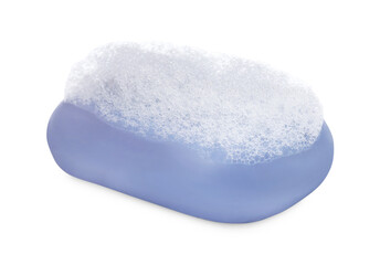 Soap bar with fluffy foam on white background