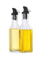 Glass bottles with cooking oil on white background