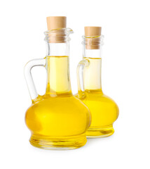 Obraz na płótnie Canvas Glass jugs of cooking oil on white background