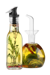 Different sorts of cooking oil with spices and herbs in bottles on white background