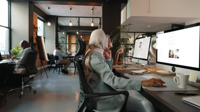 Business professionals at work in an inclusive coworking space