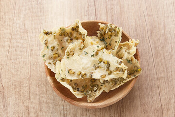Rempeyek Kacang Hijau or Tumpi, crackers made from rice flour with mung beans. Indonesian traditional food
