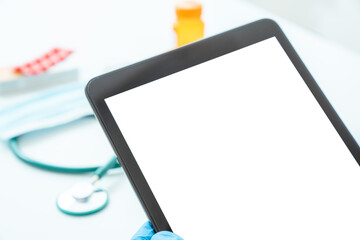 tablet blank screen on the background of medical items medical research