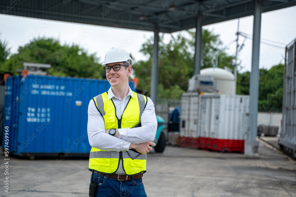 Poster industry engineer wearing safety uniform checking on production in factory.