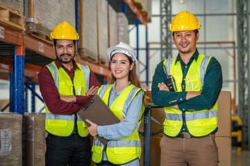 Warehouse employees uses digital tablet computer with Inventory checking software in the retail warehouse full of shelves with goods,Distribution Center.
