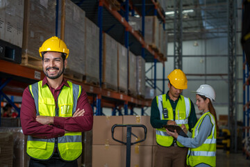 Warehouse worker checking goods and supplies on shelves with goods background in warehouse,Logistic and business export.