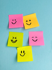 Many sticky notes with different emotions on blue background . Empathy Concept  