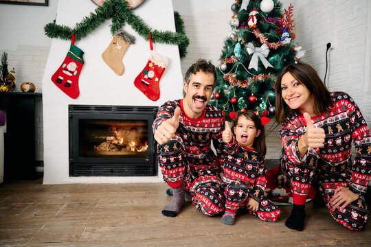 Family Wearing Matching Christmas Pajamas