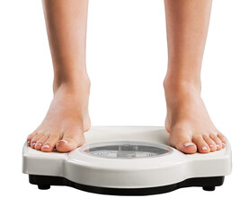 Young woman feet standing on weigh scales,