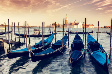 Gondolas in Venice, Italy at sunset.