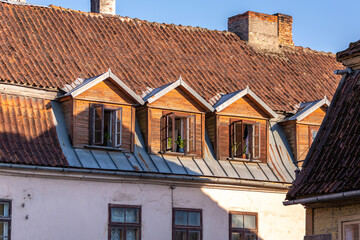 Roof room windows of the house. Attic living spaces. Urban life