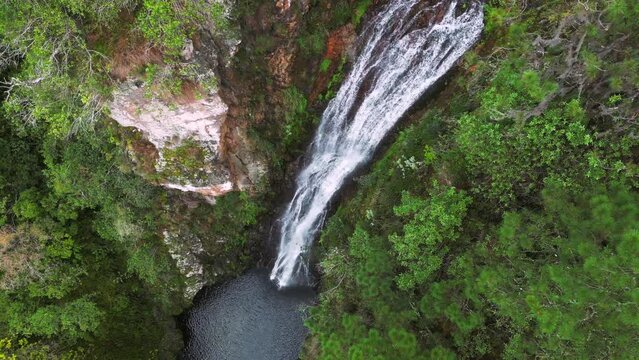 The stream of water falls into the lake. Aguas Blancas the highest Waterfall in Constanza. The beautiful nature of the Dominican Republic 
