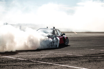 Race car drifting on speed track, Professional driver drifting car on race track with smoke,...