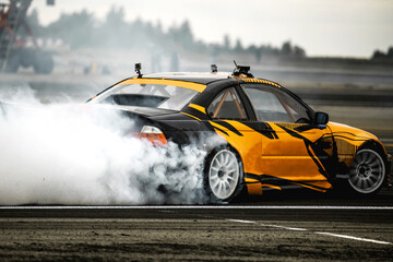 Motin Blurred car drifting on asphalt racing track with lot of smoke, motion blur drift caron Blur...