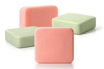 Four pieces of green and pink toilet soap on a white background. Full depth of field. With clipping path