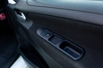 Fototapeta na wymiar power window and lock control buttons on the car door