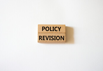 Policy revision symbol. Concept word Policy revision on wooden blocks. Beautiful white background. Business and Policy revision concept. Copy space