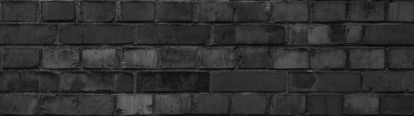 Dark black anthracite damaged rustic brick wall texture banner background panorama