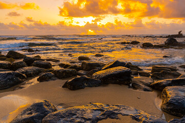 Waves Washing Over ancient Lava Boulders on Lydgate Beach at Lydgate Beach Park, Lihue, Kauai, Hawaii, USA