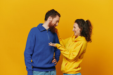 Man and woman couple smile and happiness, yellow background, family 