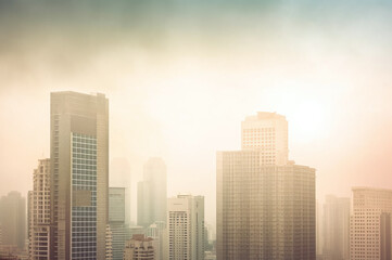 Fototapeta premium Urban cityscape with tall buildings in foggy atmosphere