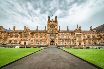 The facade of the historical University of Sydney Quadrangle in cloudy days