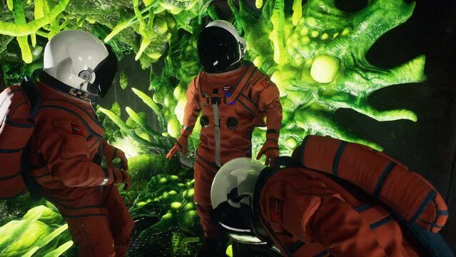 The crew members of the spacecraft are examining the airlock that has been seized by extraterrestrial beings. An eerie green invader with long tentacles has taken control of the vehicle.