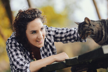 Woman with cat in the woods, w nature.