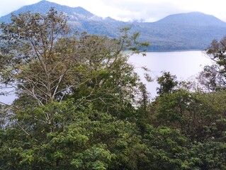 Fototapeta na wymiar Bali Island - A view of a lake with mountains in the background