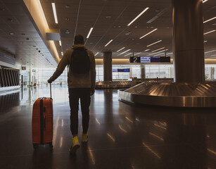 A man at the airport with a suitcase. Journey to Utah. Travel