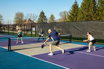 Male Pickleball Player Returning a Volley