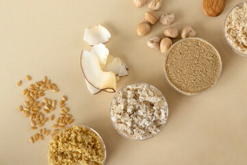 Beige background with gluten-free flax, coconut, chickpea, almond flour