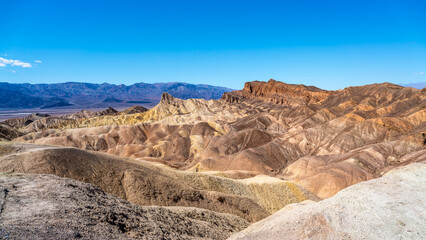 The Badlands hills at Zabriskie Point are laded with Borax which has been mined in the part but now part of Death Valley national Park in California, USA