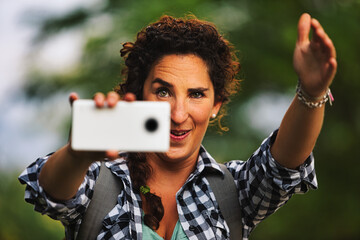 Woman acts as photographer with cell phone