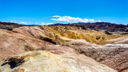 The Badlands hills at Zabriskie Point are laded with Borax which has been mined in the part but now part of Death Valley national Park in California, USA