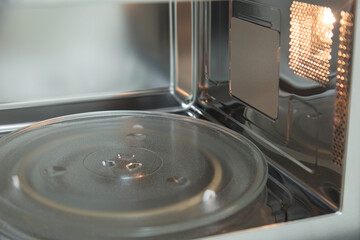 opened microwave inside oven close-up 