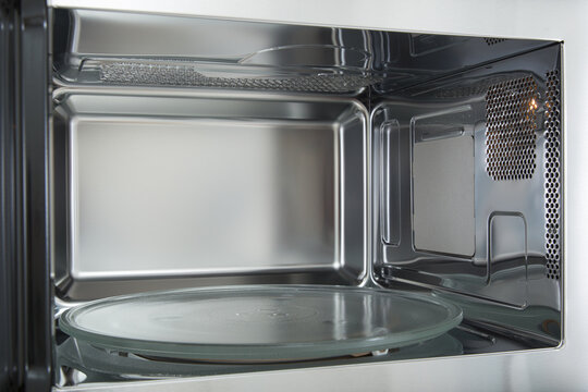 opened microwave inside oven close-up 