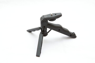The mini tripod is made of plastic that can be folded.