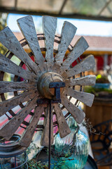Wooden wheel of a mill as a garden decoration