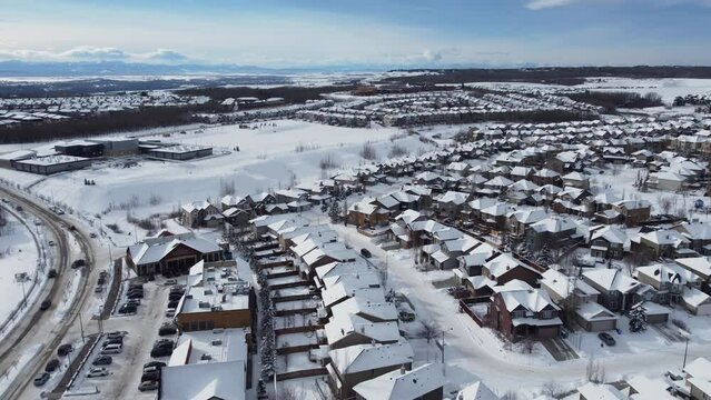 Aerial view of suburban Calgary in winter - looking towards the mountains on the west side. 