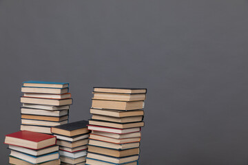 education science stack of books in the library on a gray background