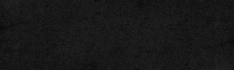 Black rough surface distressed texture. Dark wall gloomy grunge panoramic textured background