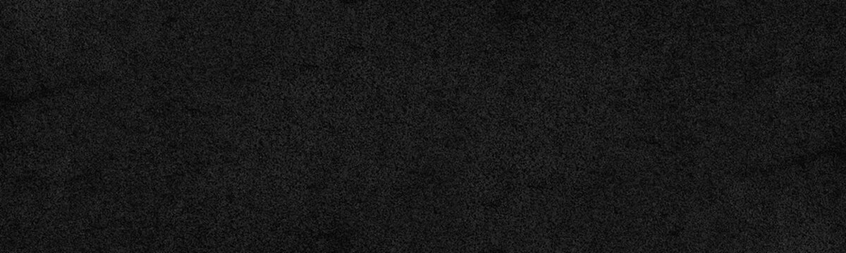 Black rough surface distressed texture. Dark wall gloomy grunge panoramic textured background