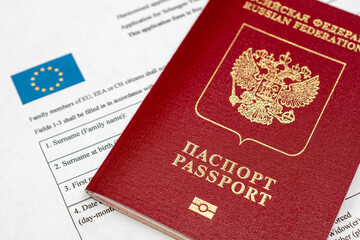 Russian travel passport with Schengen visa application form, sanctions, emigration, immigration, tourism concept