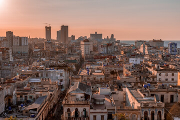 Fototapeta na wymiar View over the rooftops of Havana in Cuba at sunset with the El National hotel